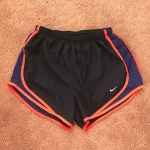 navy blue Nike Tempo shorts